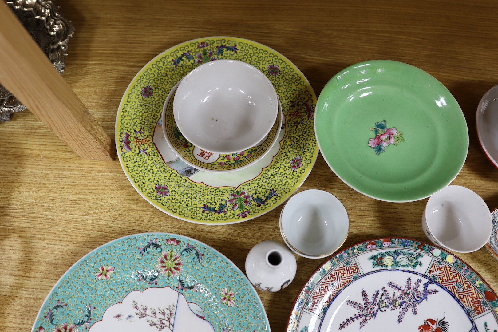 A group of Chinese enamelled porcelain plates, dishes, covers, cups and a vase